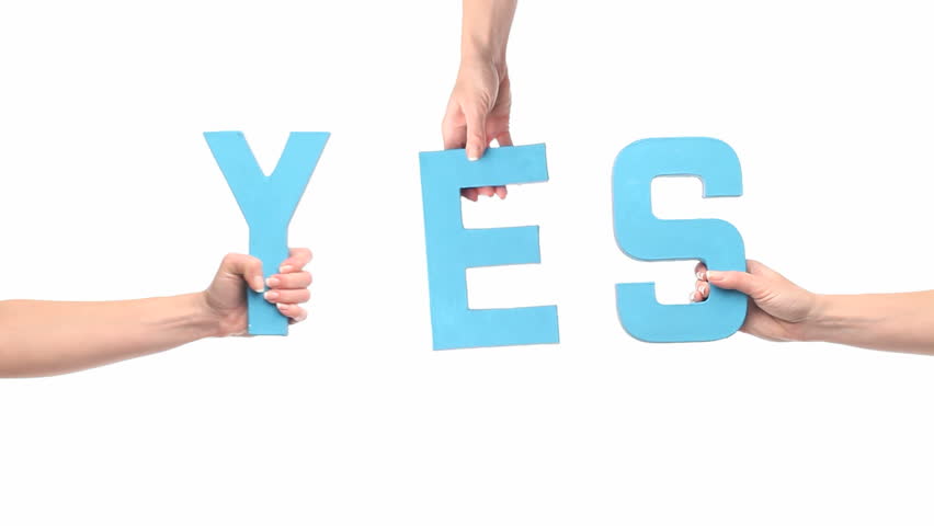 Female hands holding letters YES