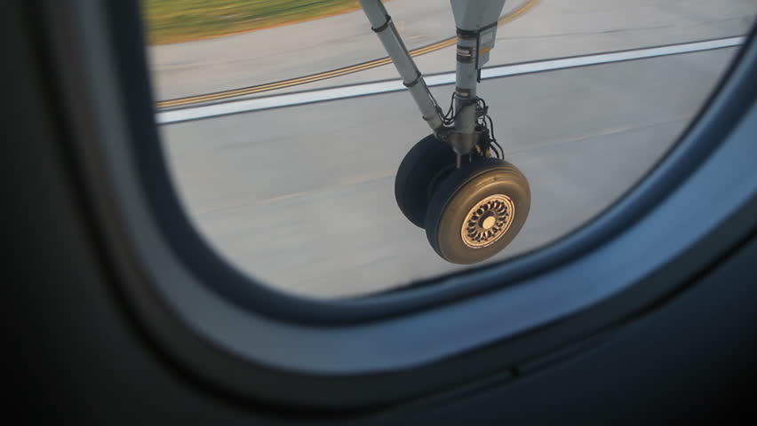 Plane wheel hitting the tarmac