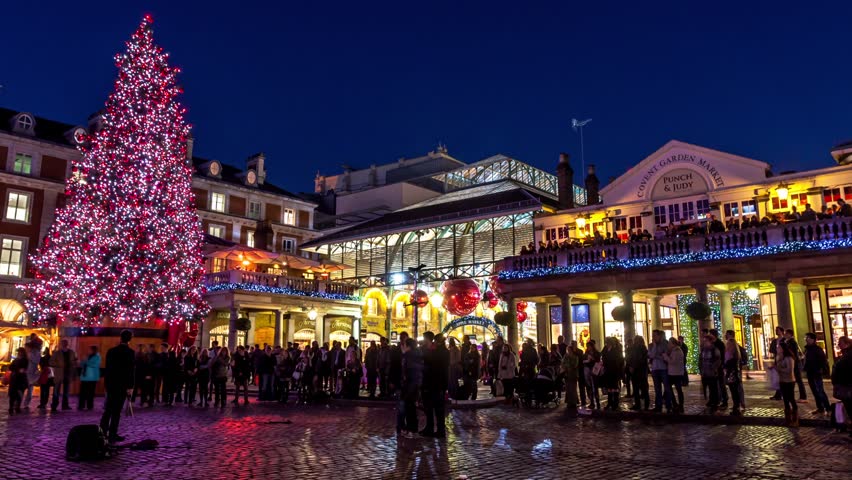LONDON - CIRCA 2012: Hyper Lapse - Time lapse of people walking through streets decorated for Christmas in Covent Garden circa 2012 in London, UK.