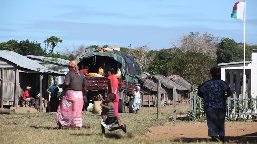 MADAGASCAR - JULY 2012. Malagasy villagers meet weekly transport truck. Funding shortfalls jeopardise World Food Programme's relief supplies deployed to cyclone-vulnerable areas in Madagascar.