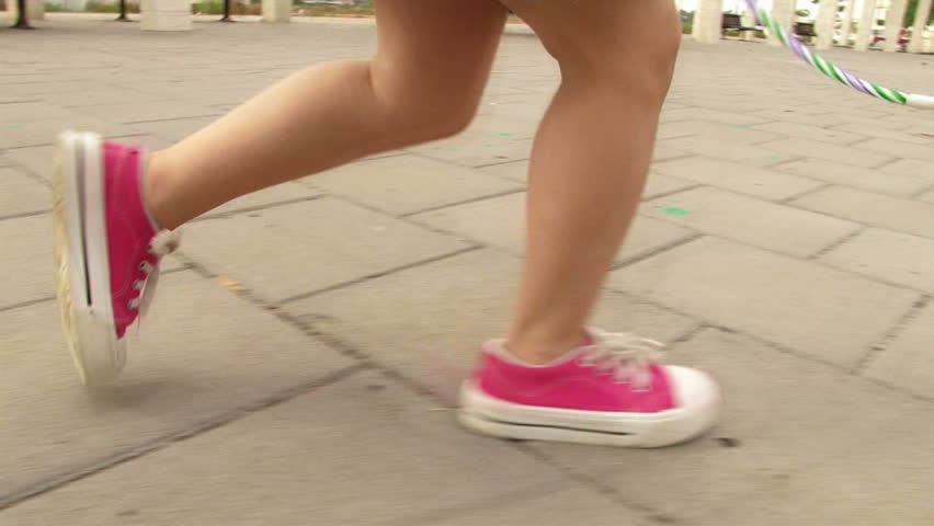 Girl running at playground / park in slow motion