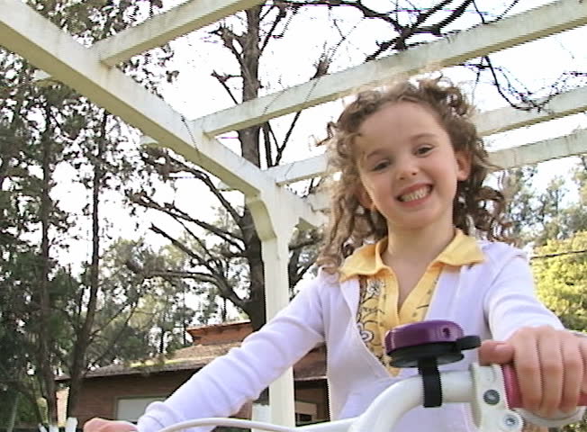 Girl riding a bicycle. Slow Motion