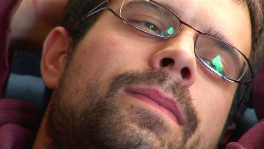 Young man looking daydreaming and talking at the end of the clip
