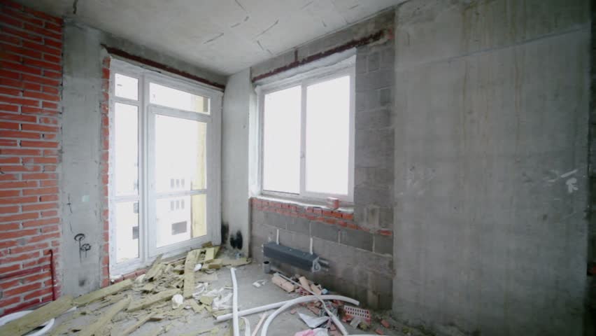 Unfinished room win plastic windows lit by day light, panoramic motion