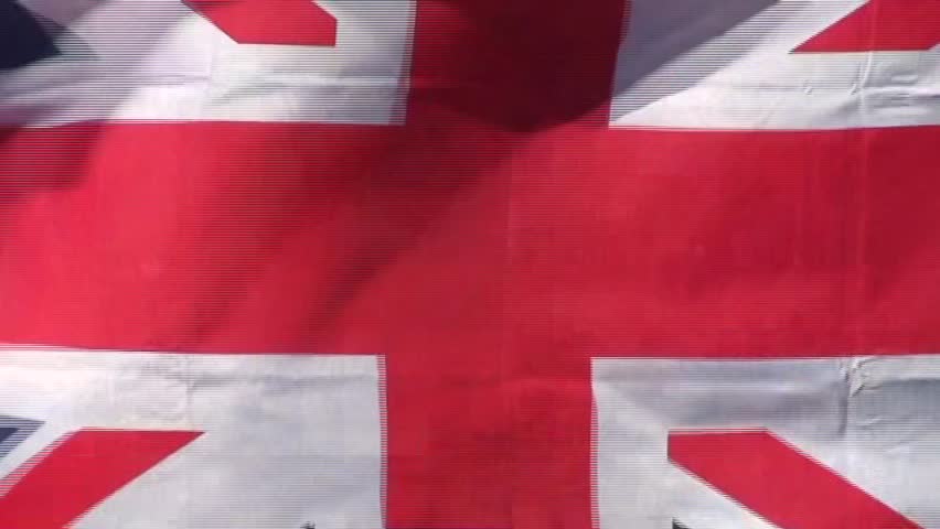 Close up of British Union Jack flag zooming out to show Straights of Gibraltar and Spain