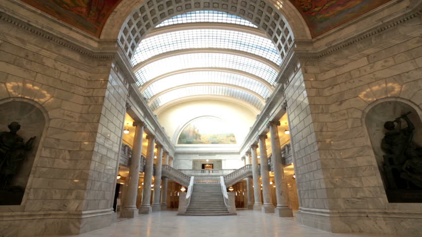 Utah State Capital rotunda inside pan. Utah State capital building high on a hill overlooking the city of Salt Lake City. Elegant architectural interior design made from marble and copper outer dome.