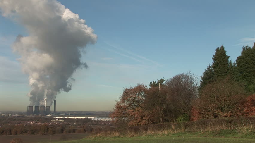 Power station pumps out vast quantities of steam and smoke in countryside