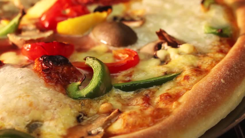 A vegetarian pizza in an oven (close-up)