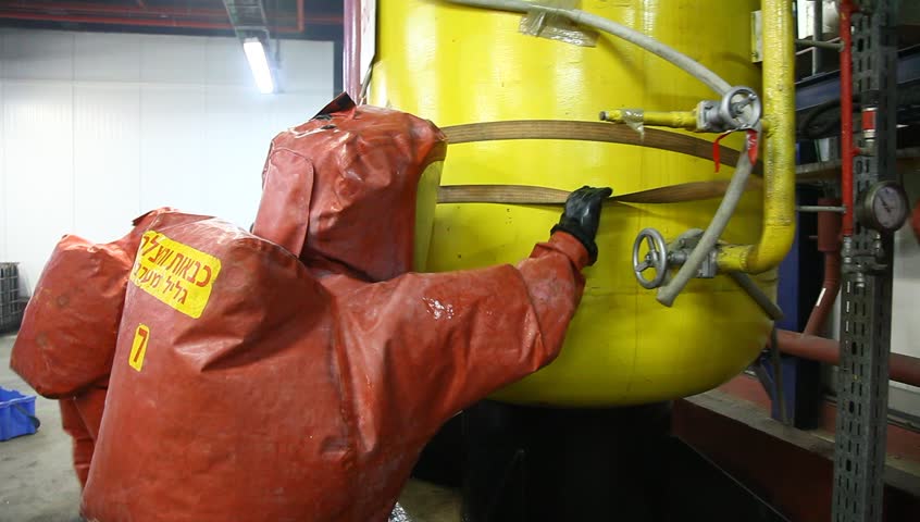 NORTHERN ISRAEL -DECEMBER 17: Firefighters practice to remedy leak accident of corrosive toxic hazardous material Ammonia liquid in seven food factories using protective suites, Northern Israel December 17 2012