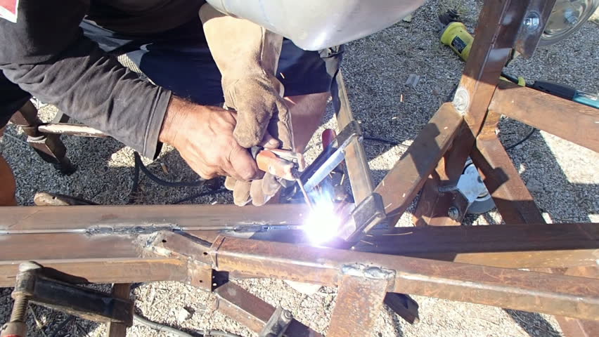 worker using an arc welder