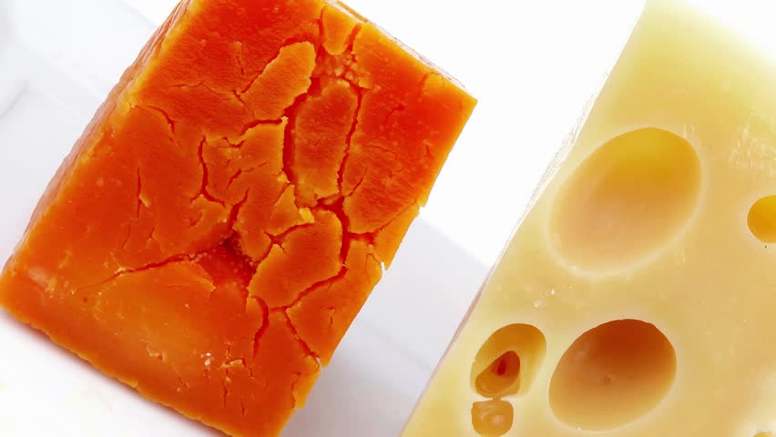 aged parmesan roquefort and gruyere chops delicatessen cheeses on white plate isolated over white background