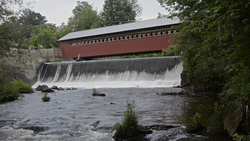 Paper Mill Village Bridge in Bennington Vermont VT 1845 red old historical over the waterfall of the river