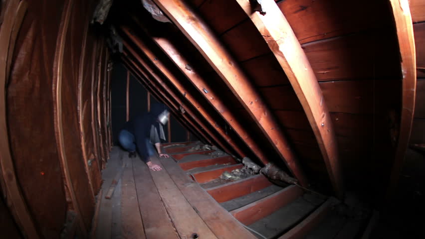 A stylized look at a crazy masked killer is trapped in an attic crawlspace.