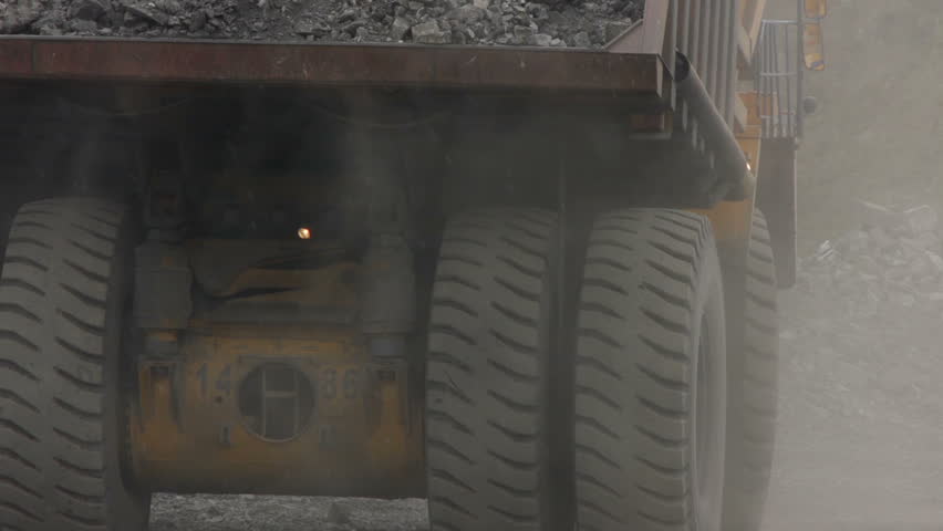 Mining dump trucks in the open pit mine, heavy truck in coal mine