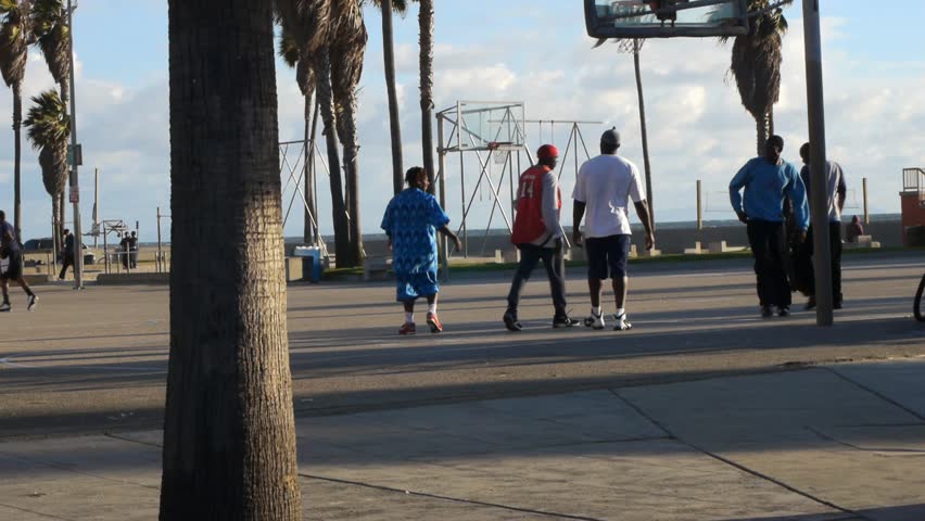 VENICE BEACH, CALIFORNIA - CIRCA 2011:  Tourists and locals walk on the boardwalk at Venice Beach, CA .