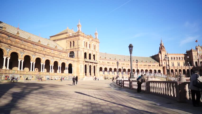 SEVILLE, SPAIN - JANUARY 6: Tourists enjoy a trip on Plaza de Espana Seville on Jan 6, 2013 It was built in 1928 for the Ibero-American Exposition of 1929 designed by famous architect Anibal Gonzalez