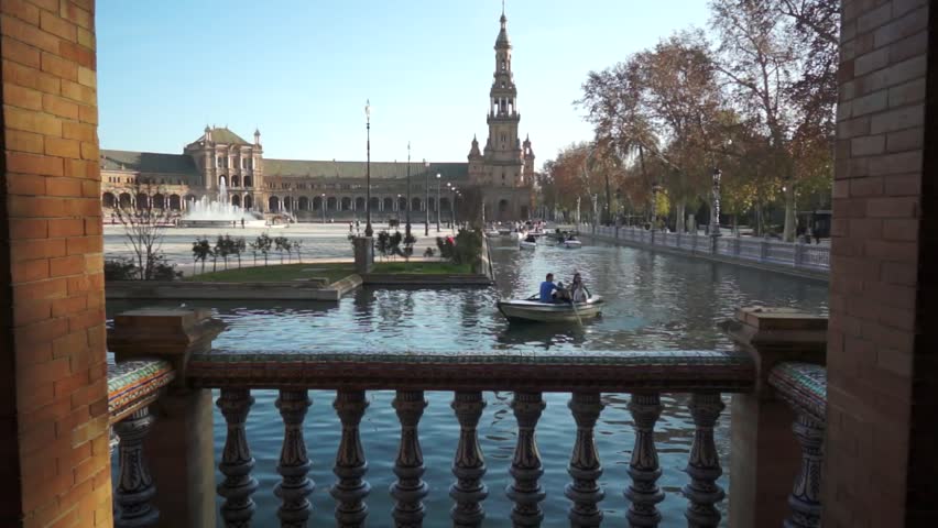 SEVILLE, SPAIN - JANUARY 6: Tourists enjoy a trip on boat on Plaza de Espana Seville on Jan 6, 2013 It was built in 1928 for the Ibero-American Exposition of 1929 designed by architect Anibal Gonzalez