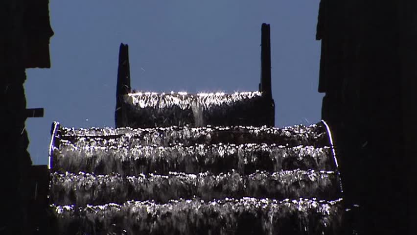 Water wheel slowly turning + water supply