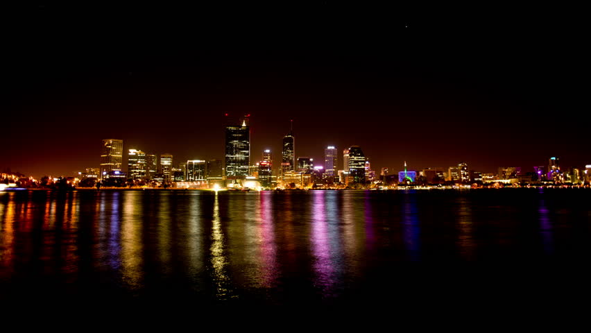 Time lapse of Perth City (Australia) with the beautiful lights of the city reflecting on the water of the Swan River.