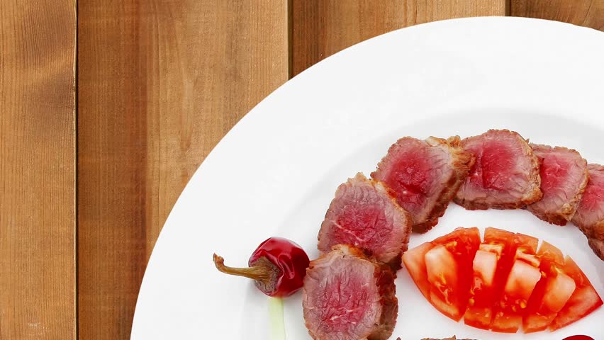 meat savory : roasted bbq meat served on white plate with tomatoes sprouts and bread slow motion hidef