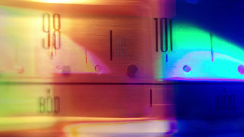 a glowing radio with the marker running through the different stations and frequencies