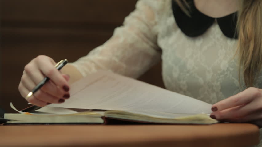 Girl gives documents for signature