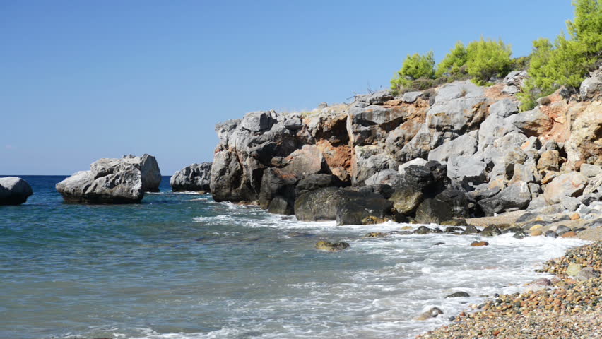 The sound of waves breaking on a stony beach