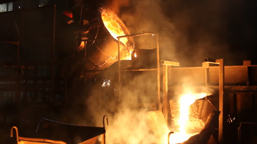 Hard work in the Foundry, liquid metal in the factory, smelting iron and processing