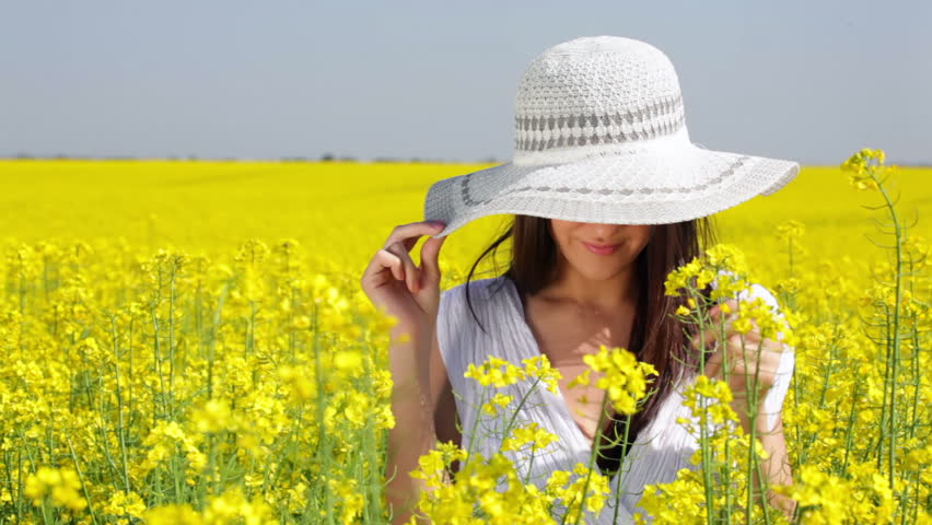 Beautiful Woman with Innocent Look in the yellow field