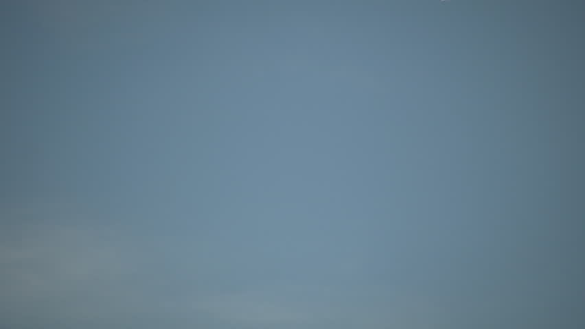 Condensation vapour trails are left behind from a passing airplane.  Also known as contrails, cirrus clouds, or wingtip vortices. (High Definition)