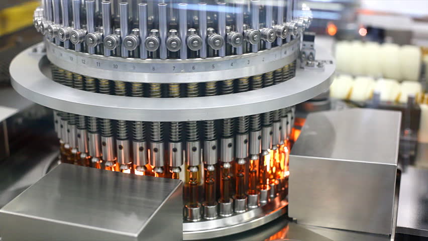 Automatic optical inspection machine, inspects vials and ampoules for particulates in liquid and container defects.