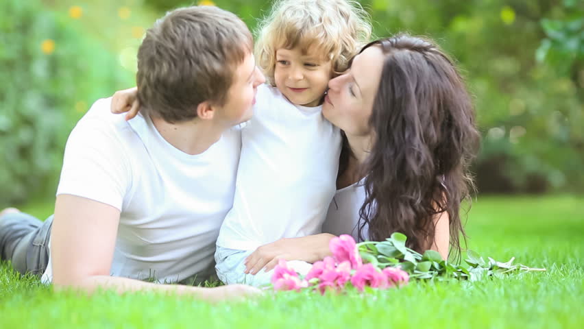 Happy family having fun outdoors in spring park 