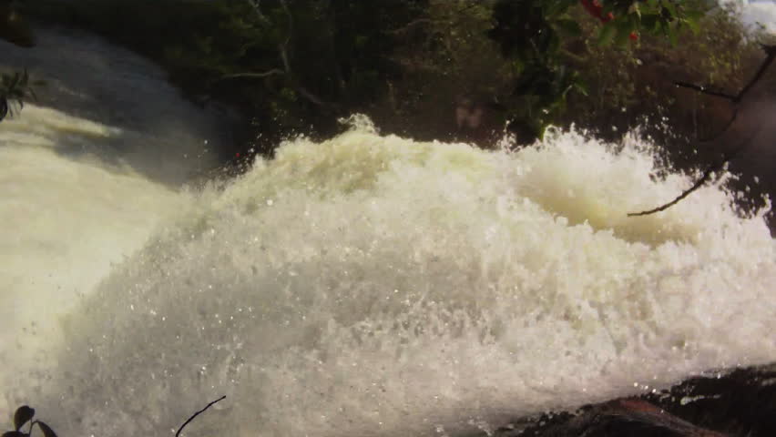waterfalls with kayak passing by