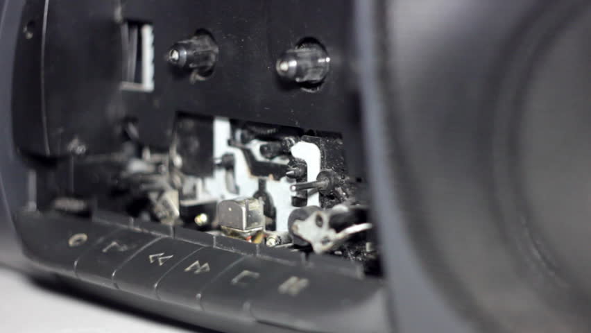 inserting cassette in the tape recorder