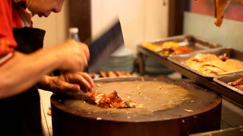 MALACCA - SEPT 1 : Chinese chef cutting slices of fresh duck in a restaurant in Malacca Malaysia on 1 september 2012.