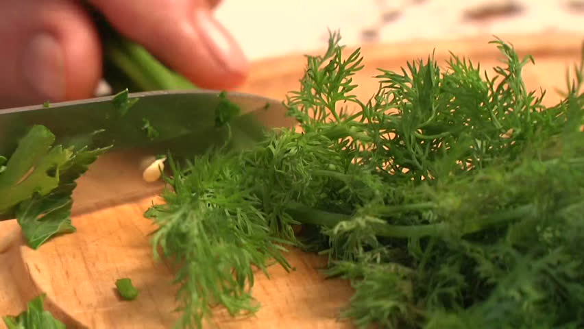 cutting dill in the kitchen