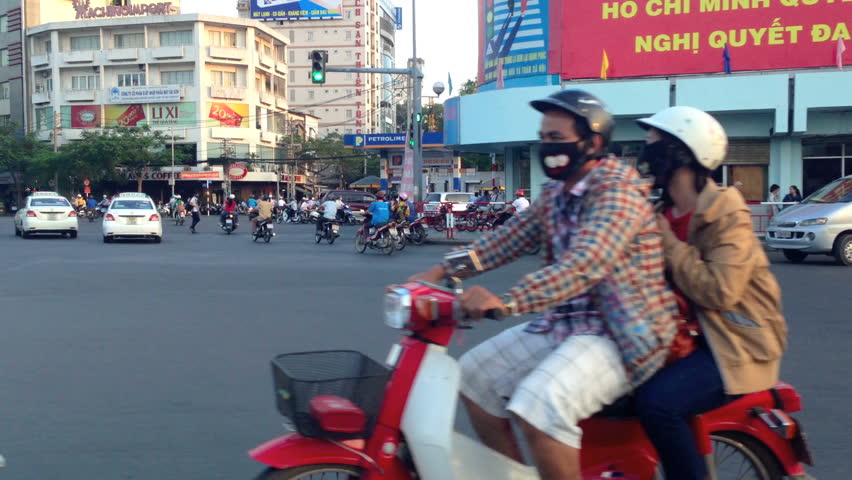 HO CHI MINH CITY - FEBRUARY 1: Panning view of scooter traffic in Ho Chi Minh City, Vietnam, in February 1, 2013