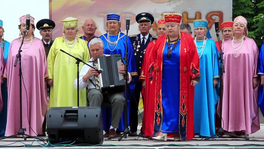KIEV, UKRAINE, MAY 9, 2012: Holiday concert dedicated to the 67th Anniversary of victory in Great Patriotic War(World War II). Women in coloured costume sing Ukrainian song, Kiev, Ukraine, May 9, 2012