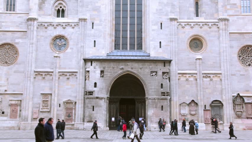 VIENNA- FEB 19: tourists walk near St Stephens Cathedral on Feb 19, 2011, in Vienna, Austria. Sacred Stephanes cathedral in Vienna - Catholic cathedral, national symbol of Austria and symbol of Vienna
