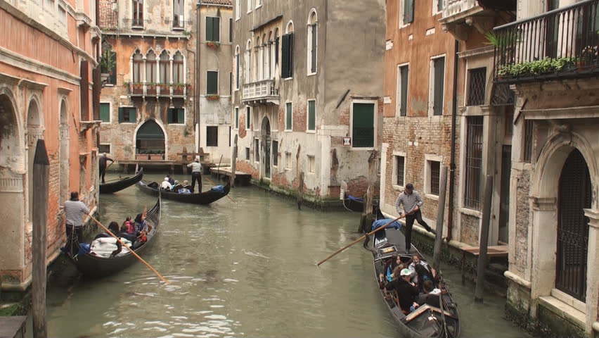 VENICE, ITALY - MAY 11: Gondolas in one of the canals in Venice on May 11, 2012. Gondolas are now mainly used for touristic purposes but where once the main form of transportation in Venice.