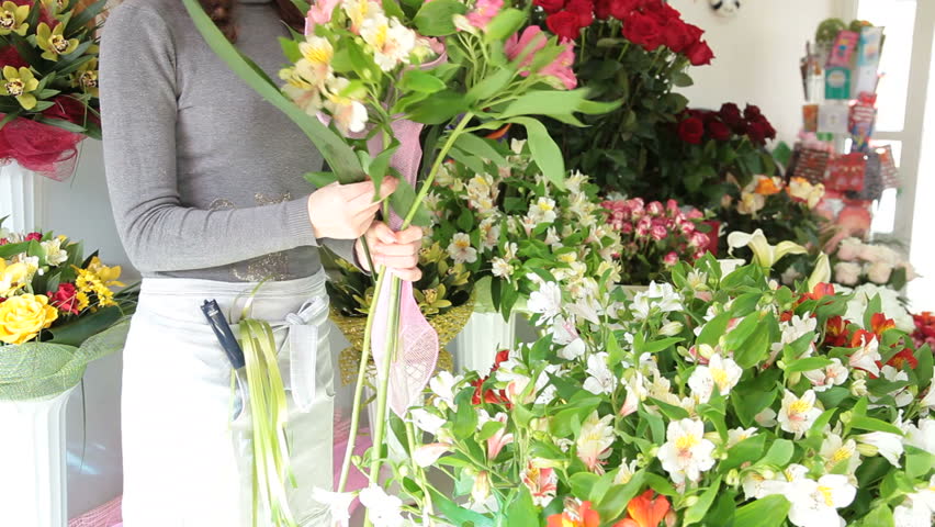Florist Arranging Bunch Of Flowers In Floristry Shop