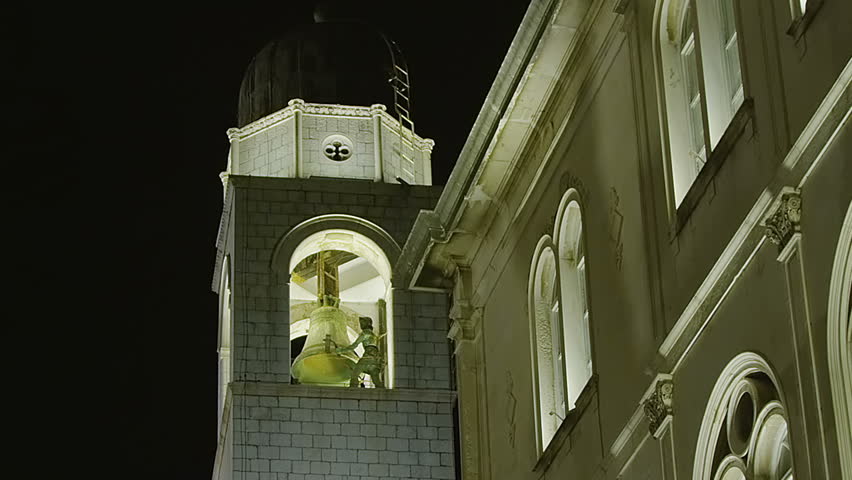 Famous Dubrovnik old city tower with clock. Two bronze statues "Maro" and "Baro" strike the bell.