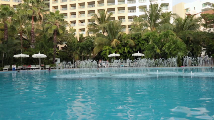 PUERTO VALLARTA, MEXICO NOV 2012: Mexican economy and tourism improves bringing increased income to business and resorts. Swimming pool luxury hotel fountain. Luxury high priced resort hotel complex.