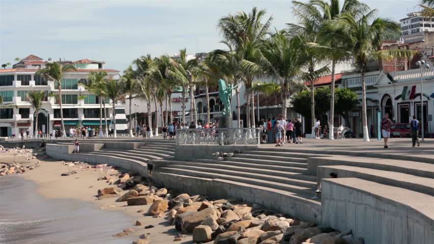 PUERTO VALLARTA, MEXICO NOV 2012: Economy and tourism improves bringing tourist back to the ocean side city. Puerto Vallarta Malecon Boardwalk Seahorse. Malecon beach on Banderas Bay Pacific Ocean.