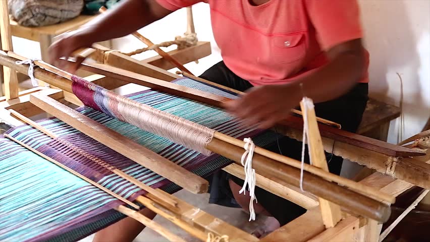 Local women exhibit new skill after training to weave in order to earn an income to survive and feed their families in Ranomafana, Madagascar.