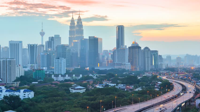 Time lapse of cloud scape and busy traffic during sunset of Kuala Lumpur, Malaysia