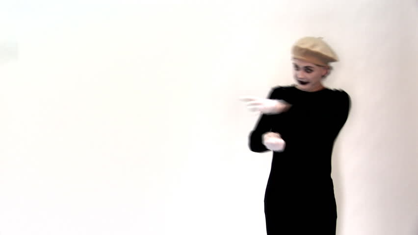 mime on a white background attracts the object and shows it in the plastic