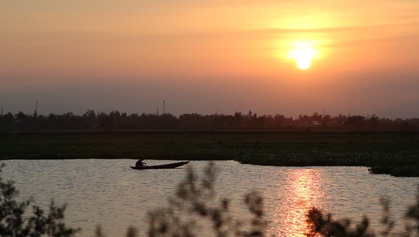 Fisher boat in the river with sunset in vietnam
