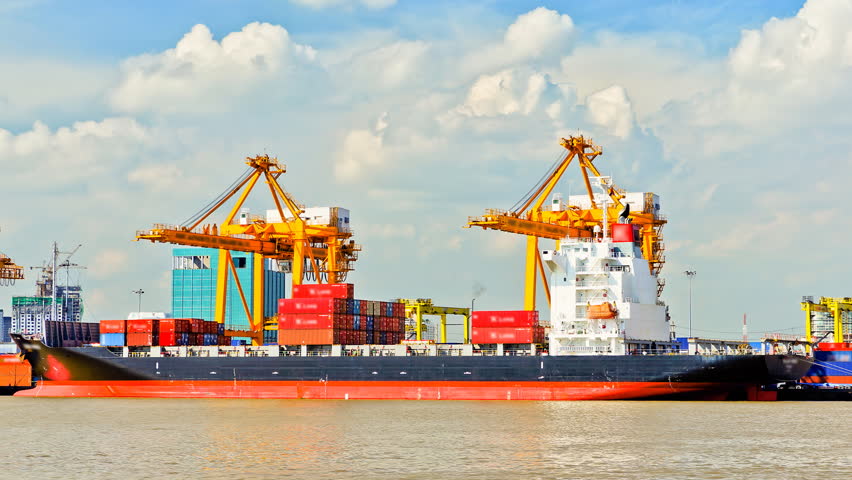 Container Cargo freight ship with working crane bridge in shipyard for Logistic Import Export background 