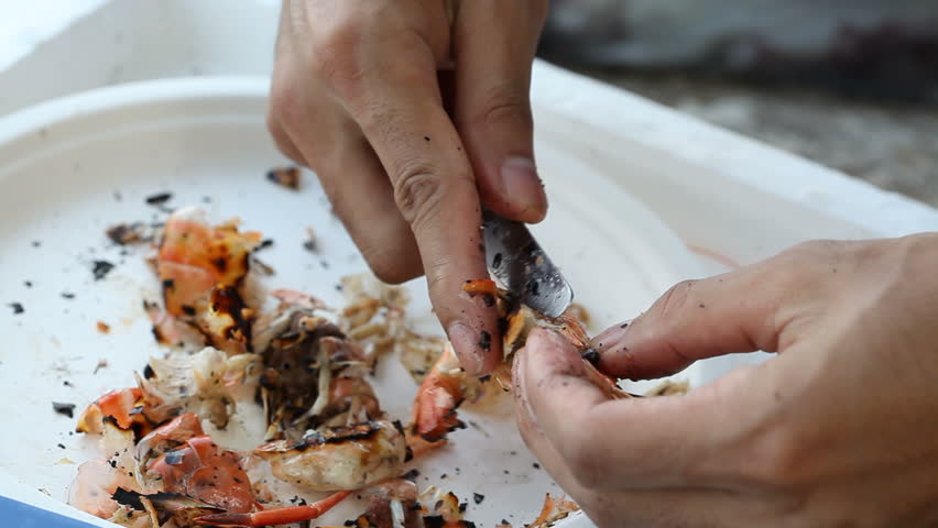 Peeling prawn with knife